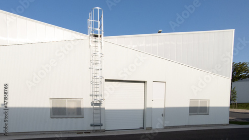 industrial building white facade exterior of modern warehouse © OceanProd