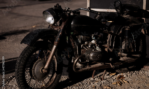 Fototapeta Naklejka Na Ścianę i Meble -  old rusty black motorcycle