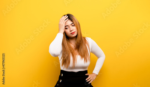 Foto Portrait of a beautiful brown-haired girl Asian girl touches her temple have a s