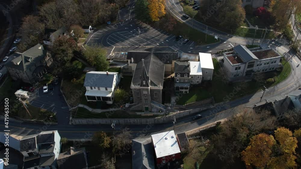 Ellicott City, Maryland USA, Aerial View of St. Paul Catholic Church on Sunny Autumn Evening, Drone Shot Ellicott City, Maryland USA, Aerial View of St. Paul Catholic Church on Sunny Autumn Evening, Drone Shot