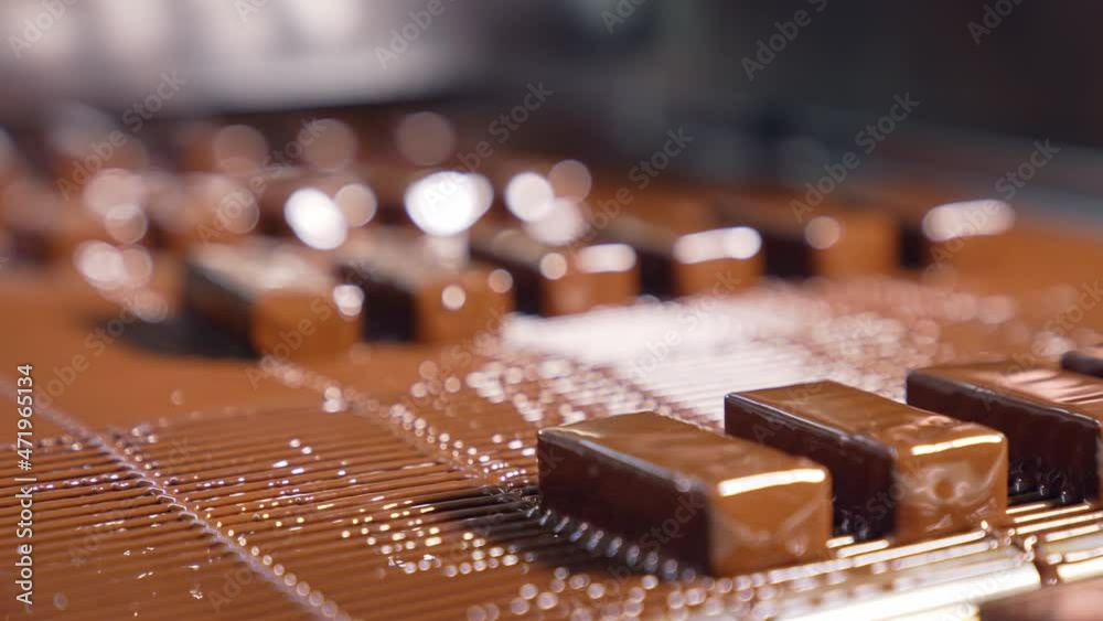Tasty chocolate conveyor deserts. Sweet candies manufacturing on production line. Tasty chocolate conveyor deserts. Sweet candies manufacturing on production line.