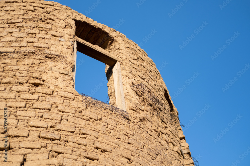 Earth house with blue sky background ,Traditional house of clay and straw