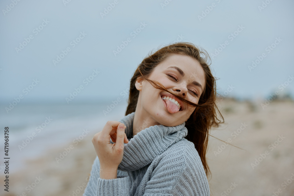cheerful woman with long hair on the beach nature landscape walk Lifestyle cheerful woman with long hair on the beach nature landscape walk Lifestyle