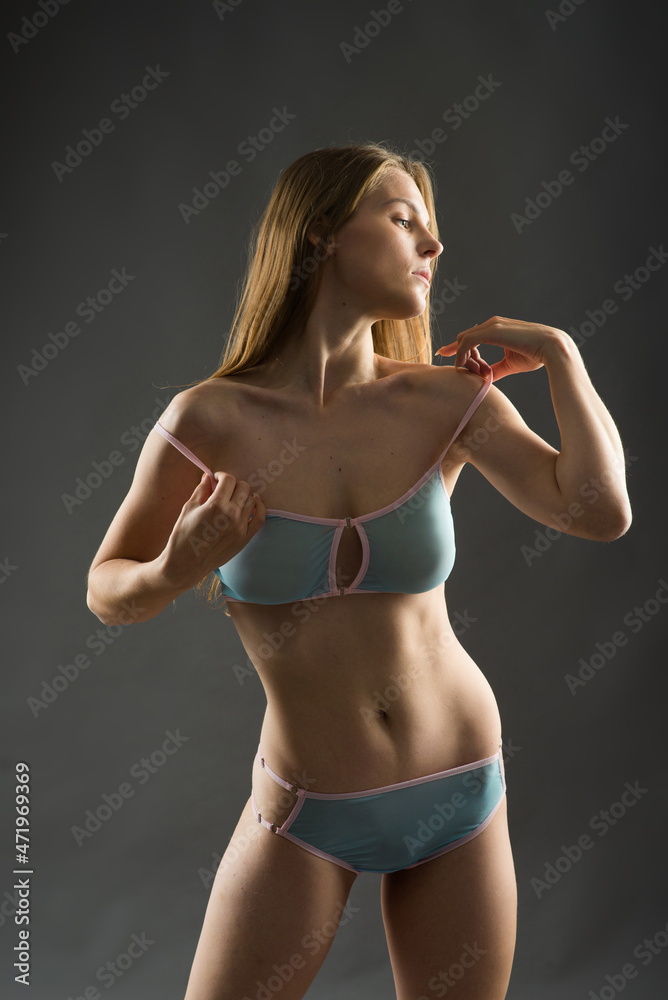 Seductive woman in bikini having fun laughing with her long hair flying free Seductive woman in bikini having fun laughing with her long hair flying free