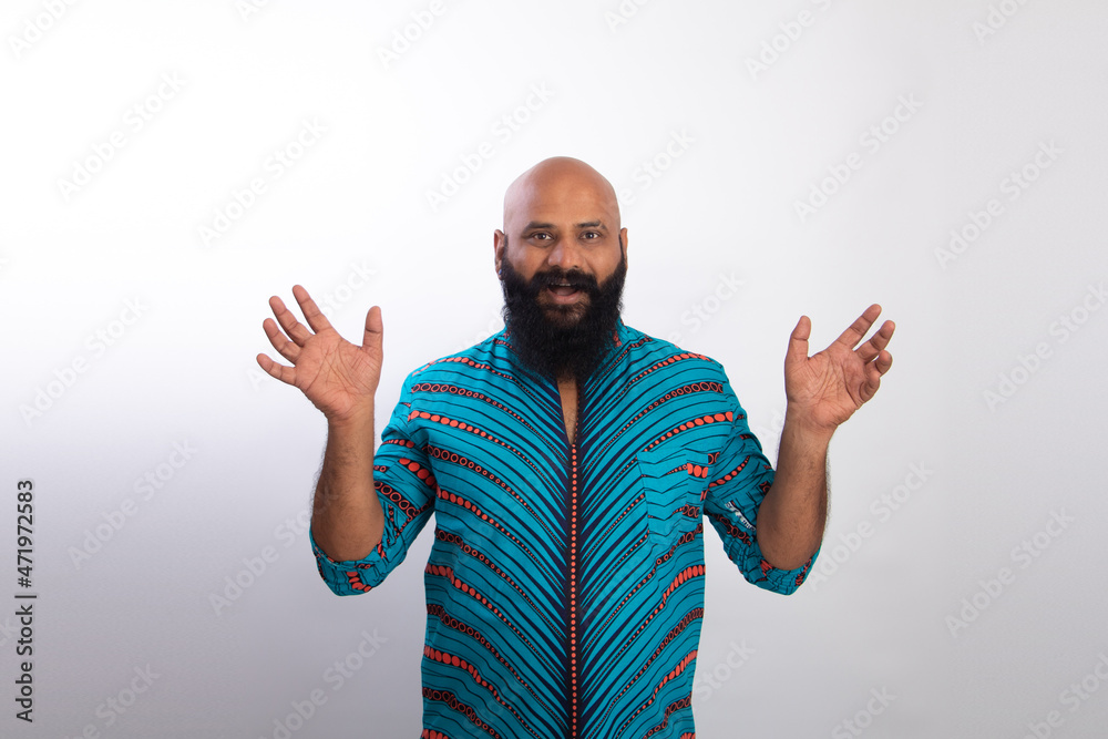 Naklejka premium Surprised Indian healthy bald beard man. People lifestyle concept. Keeping mouth open spreading hands