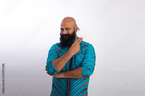 happy Indian Healthy middle aged man Folding arms pointing up with two fingers