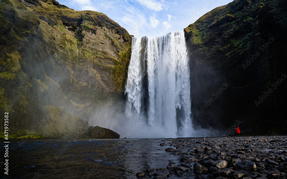 Obraz premium Skogafoss waterfall with rainbow in summer sunshine, South coast, Iceland - 