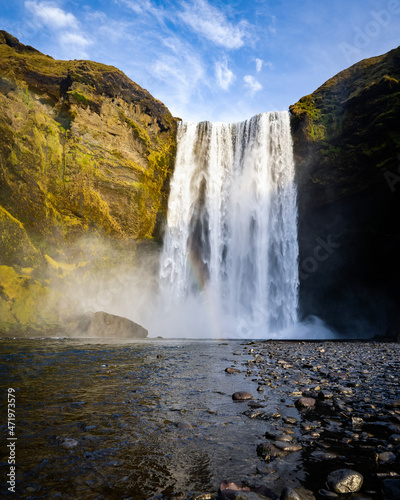 Icelandic Landscape. Classic long exposure view of famous Skogafoss waterfall with colorful sky during sunset. Skoga river, highlands of Iceland, Europe. 