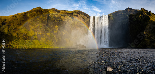 Icelandic Landscape. Classic long exposure view of famous Skogafoss waterfall with colorful sky during sunset. Skoga river  highlands of Iceland  Europe. 