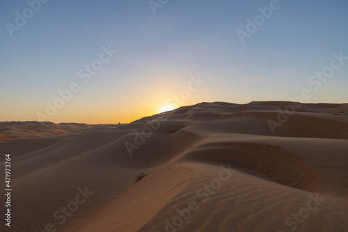 Sunset in the arabian desert with rolling sand dunes in Abu Dhabi, United Arab Emirates © hyserb