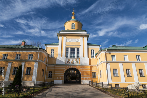 View of the southern gate with the gateway church of St. Mitrofan of the Voronezh Pokrovsky Khotkov monastery in autumn. Khotkovo, Moscow region, Russia photo