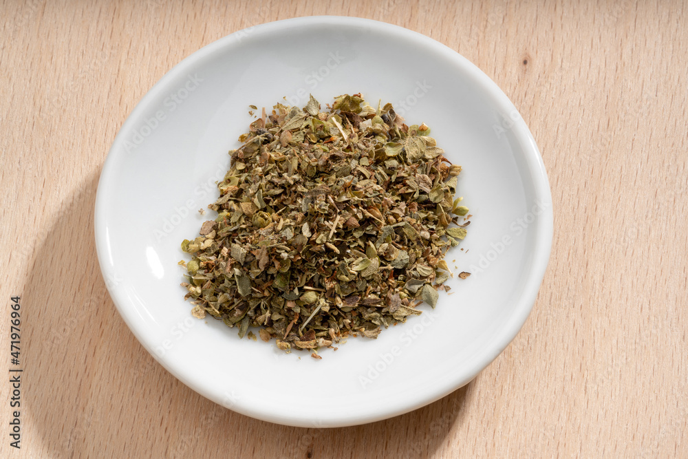 Detailed and large close up shot of oregano on a small plate Detailed and large close up shot of oregano on a small plate