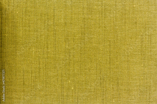 Blank abstract background of yellow shaded textile pattern, grunge linen cloth texture