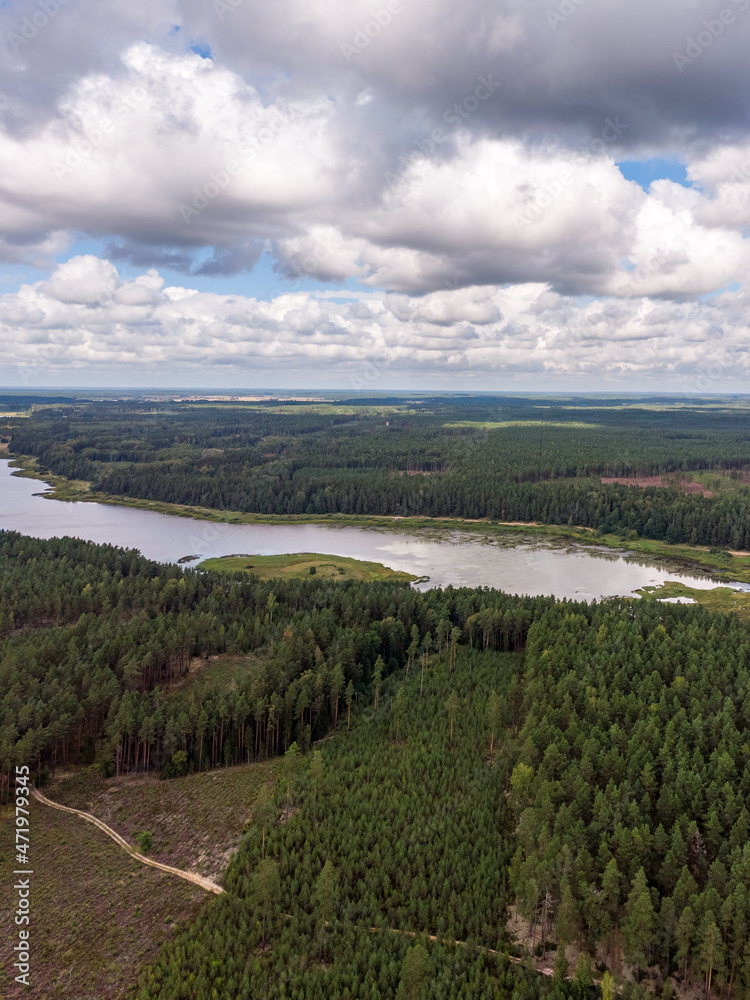 Obraz premium Areal drone photography view of countryside forest and small lake.