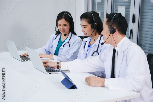 team doctor and nurse working call center operator with headset in hospital or workplace