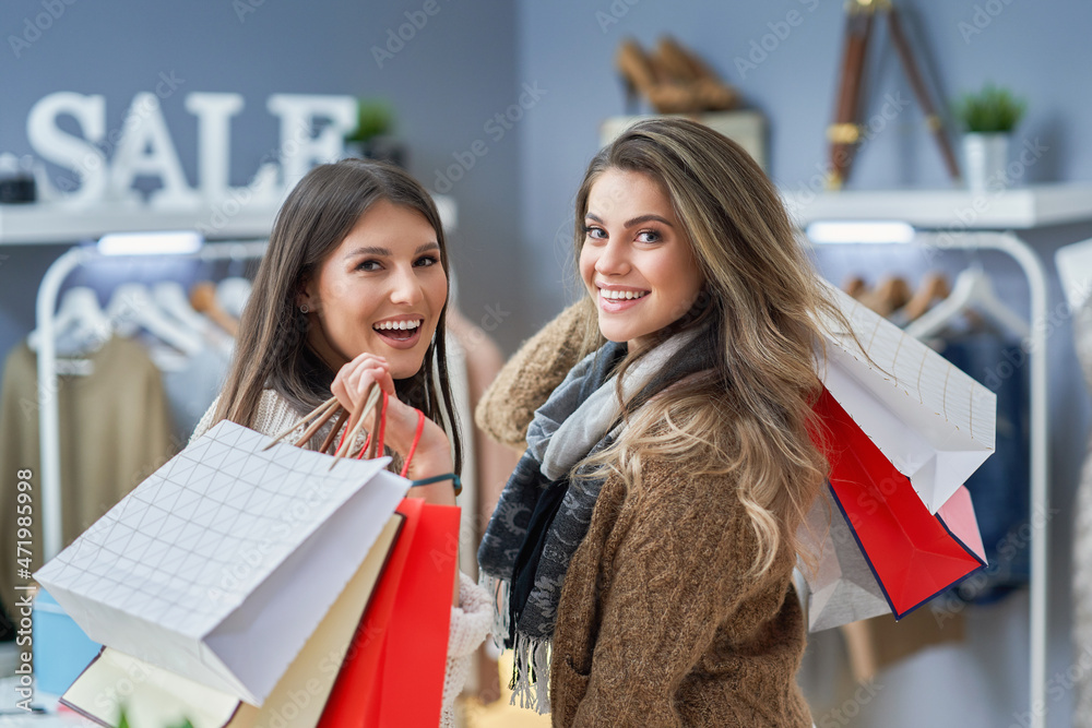 Group of happy friends during shopping Group of happy friends during shopping