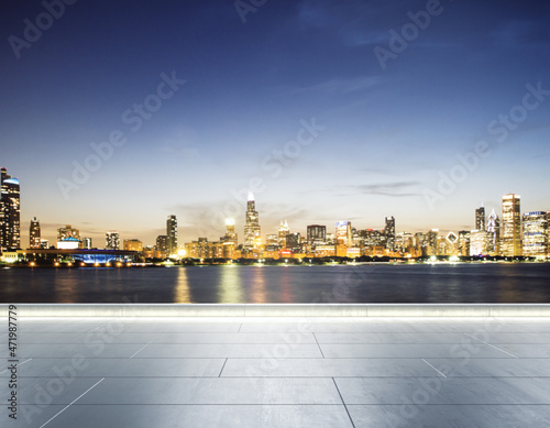 Empty concrete seafront on the background of a beautiful blurry Chicago city skyline at twilight, mockup