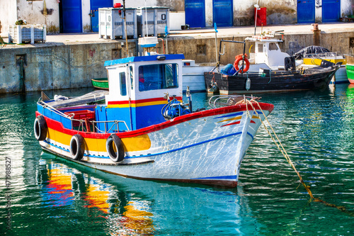 Boat in the Fishing Harbor of Sesimbra, Portugal photo