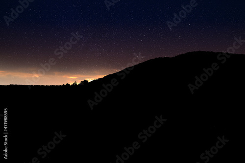 Beautiful view of starry sky over mountains at night