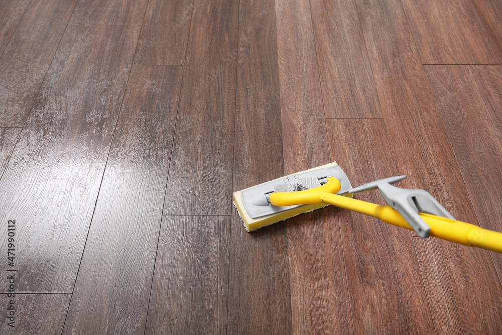 Washing of floor with mop. Difference before and after cleaning Stock