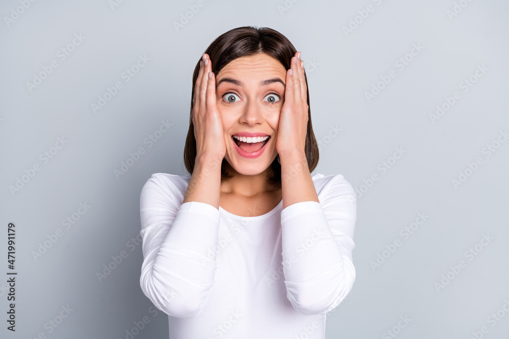 Photo of cool bob hairdo millennial lady arms head wear white shirt isolated on grey color background Photo of cool bob hairdo millennial lady arms head wear white shirt isolated on grey color background