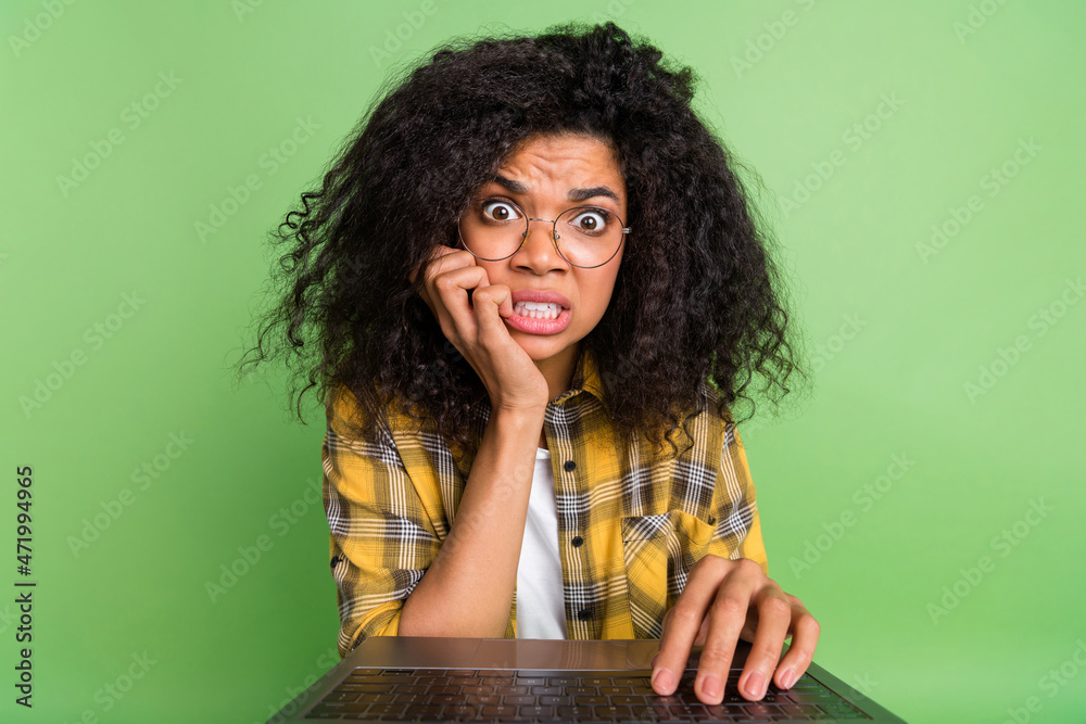 Photo of sad valume hairdo millennial lady write laptop wear eyewear plaid shirt isolated on green background