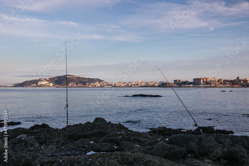 View of fishing rods on a beach in the north bay of Ceuta