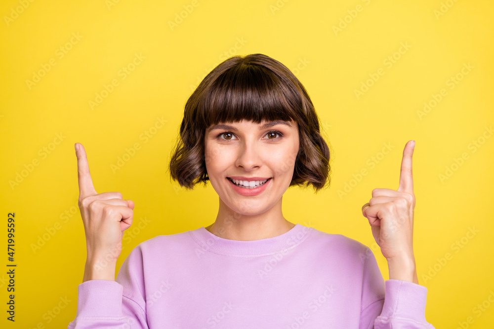 Portrait of attractive cheerful girl demonstrating up copy space advert ad look idea isolated over bright yellow color background Portrait of attractive cheerful girl demonstrating up copy space advert ad look idea isolated over bright yellow color background