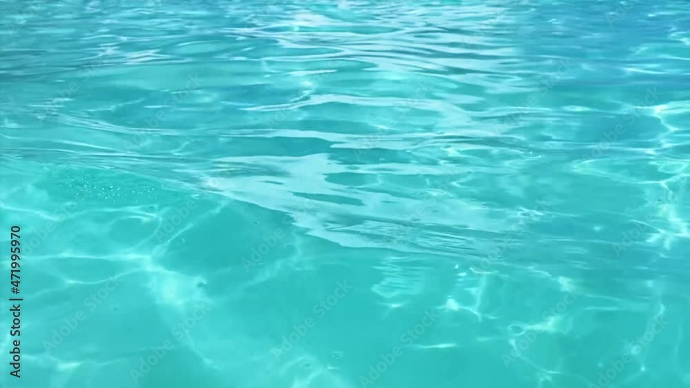 Close-up of the azure water of the ocean. Vacation and travel concept Close-up of the azure water of the ocean. Vacation and travel concept