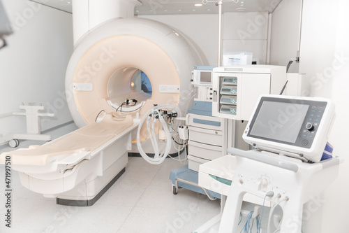 Medical CT or MRI Scan in the modern hospital laboratory. Interior of radiography department. Technologically advanced equipment in white room. Magnetic resonance diagnostics machine. photo