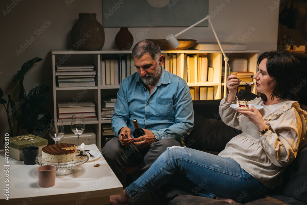 adult couple celebrating anniversary at home