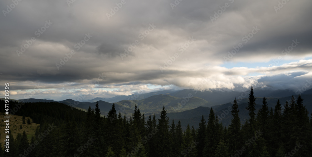 Austrian mountains alps, autumn panorama, sky in the clouds, natural background, mountain tourism. Banner.