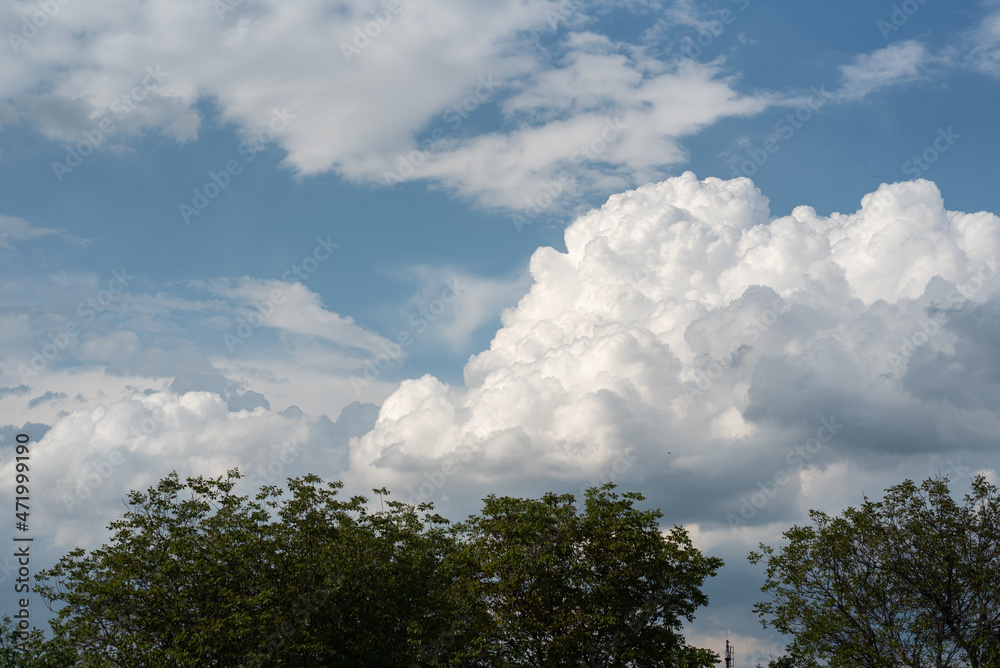 Huge white rain shower clouds over the sky Huge white rain shower clouds over the sky