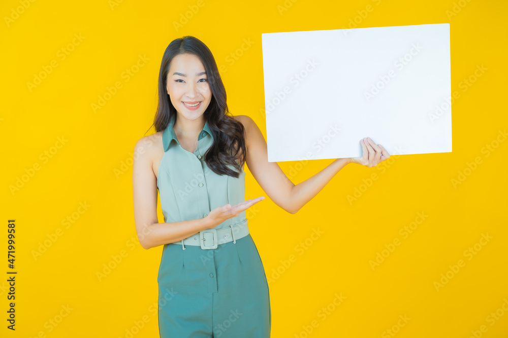 Portrait beautiful young asian woman with empty white billboard Portrait beautiful young asian woman with empty white billboard