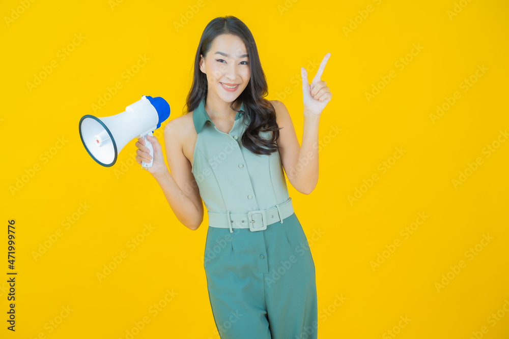 Portrait beautiful young asian woman smile with megaphone Portrait beautiful young asian woman smile with megaphone