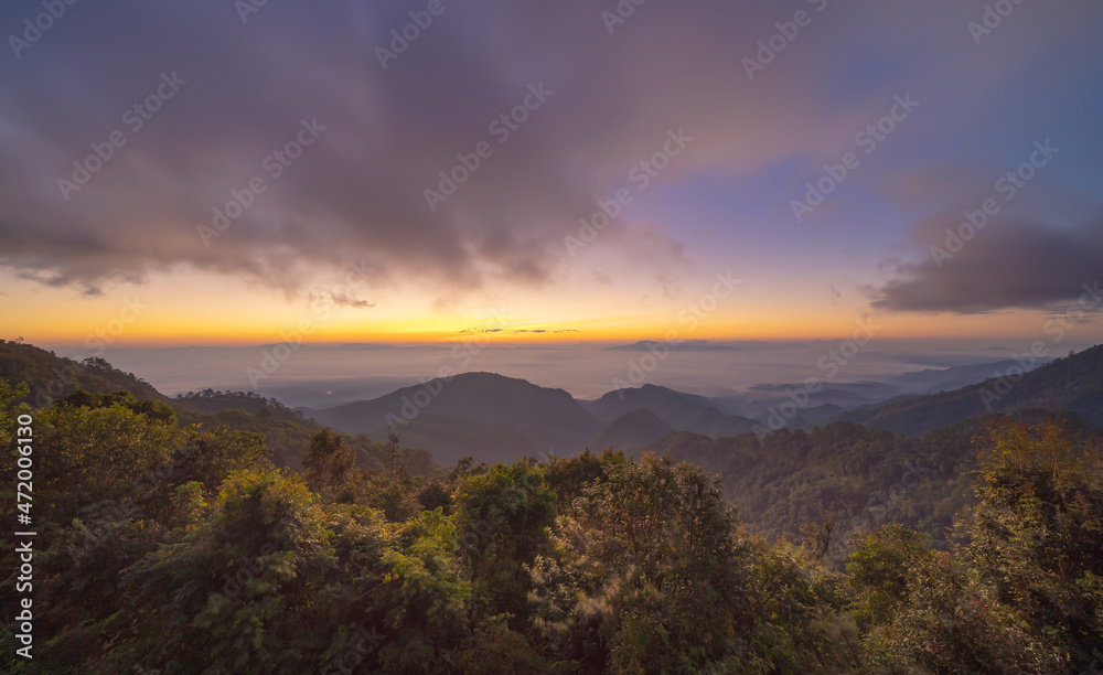 Aerial view of sunrise above fluffy sea fog misty clouds with mountain hill from Phu Tub Berk, Khao Kho, Phetchabun, Thailand with sunlight. Nature landscape background in sunset.