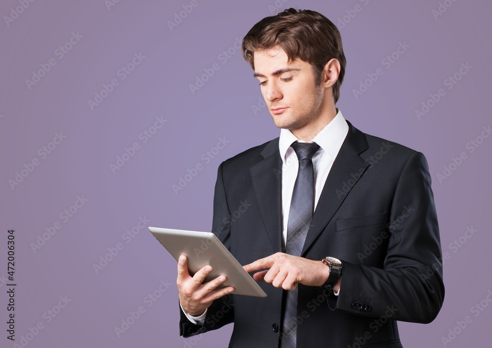 Young cool student in casual clothes use work on tablet pc computers Young cool student in casual clothes use work on tablet pc computers
