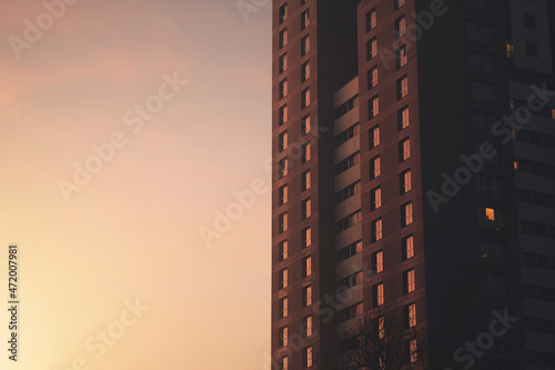  Multi-storey house on early morning, sun effect