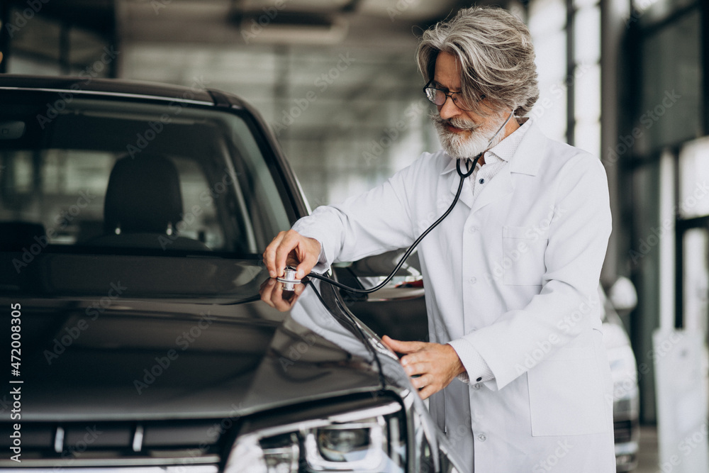 Senior doctor looking after a car