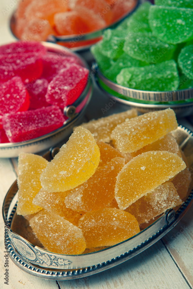 Dessert marmalade in the form of lemon and orange slices. The sweetness of jelly candy. Dessert marmalade in the form of lemon and orange slices. The sweetness of jelly candy.