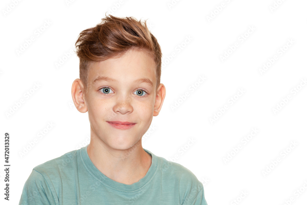 a boy with a tousled hairstyle is smiling at the camera a boy with a tousled hairstyle is smiling at the camera
