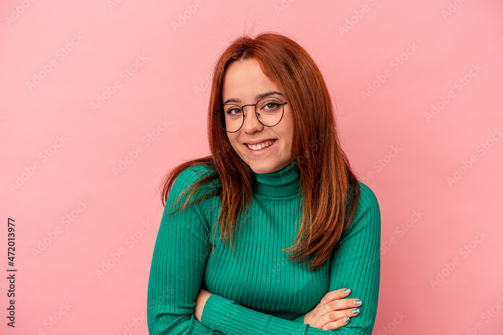 Young caucasian woman isolated on pink background laughing and having fun. Young caucasian woman isolated on pink background laughing and having fun.
