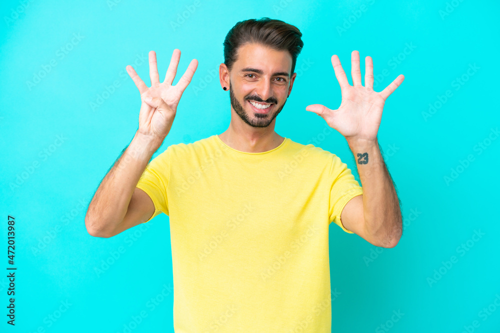 Young caucasian man isolated on blue background counting nine with fingers Young caucasian man isolated on blue background counting nine with fingers