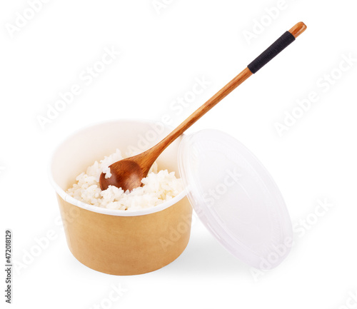 White long prepared rice in the ppper box for take out on white wooden background, top-view flat lay