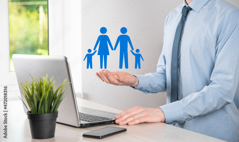 Hand hold young family icon. Family life insurance,supporting and services,family policy and supporting families concepts.Happy family concept.Copy space.mancupped hands showing paper man family