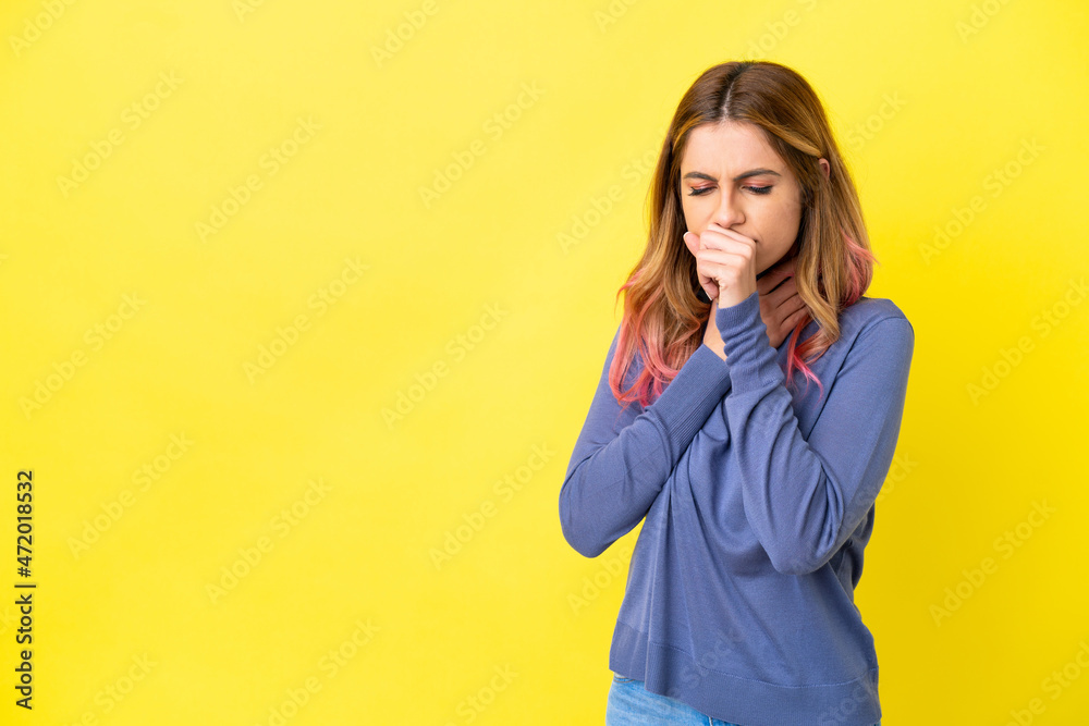 Young woman over isolated yellow background coughing a lot Young woman over isolated yellow background coughing a lot
