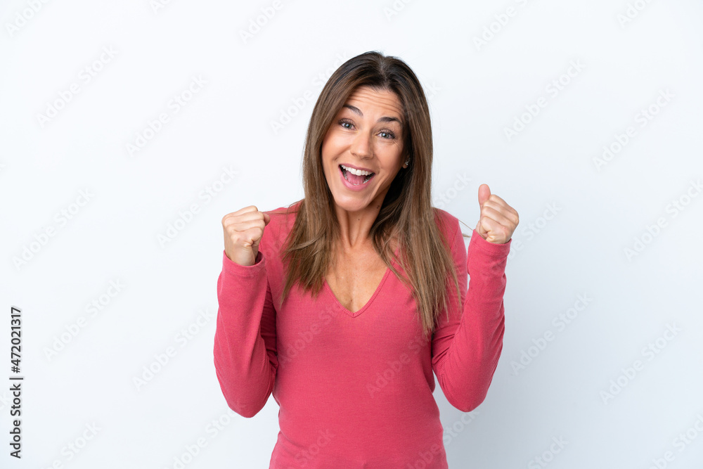 Middle age caucasian woman isolated on white background celebrating a victory in winner position Middle age caucasian woman isolated on white background celebrating a victory in winner position