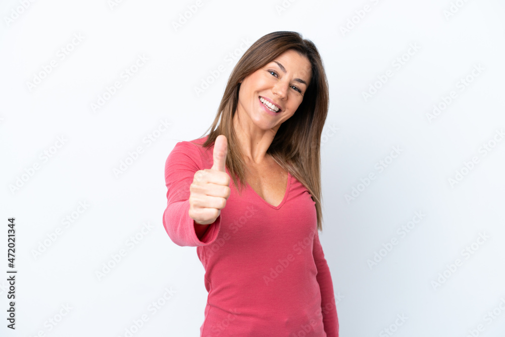 Middle age caucasian woman isolated on white background with thumbs up because something good has happened Middle age caucasian woman isolated on white background with thumbs up because something good has happened