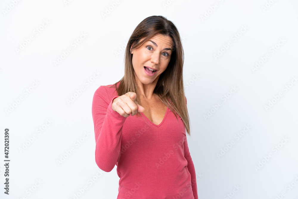 Middle age caucasian woman isolated on white background surprised and pointing front Middle age caucasian woman isolated on white background surprised and pointing front