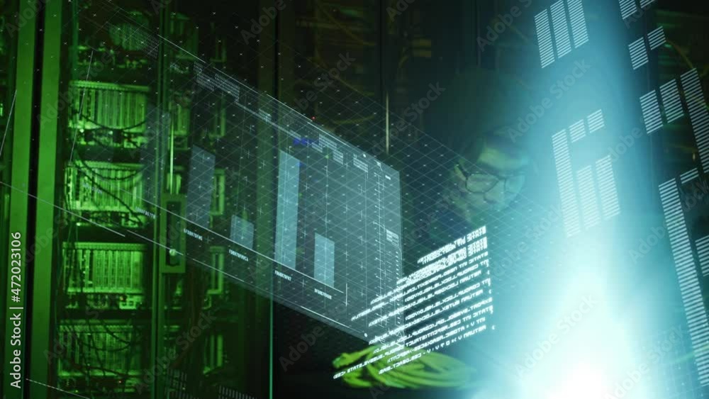 Animation of data processing over asian male hacker in hoodie with laptop by computer servers Animation of data processing over asian male hacker in hoodie with laptop by computer servers
